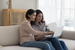 mother and daughter on the laptop talking about healthcare directives